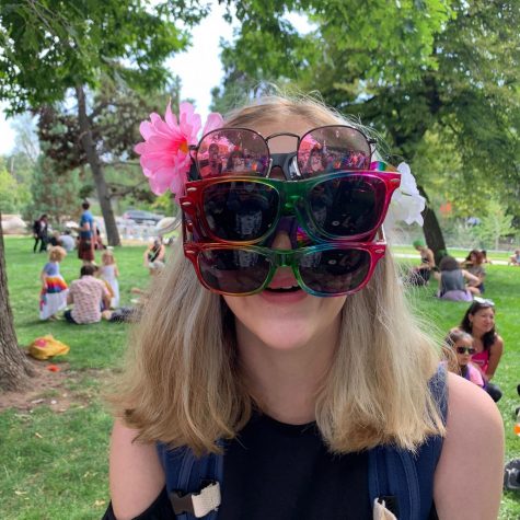 A Boulder High student wears 4 pairs of sunglasses at pride.