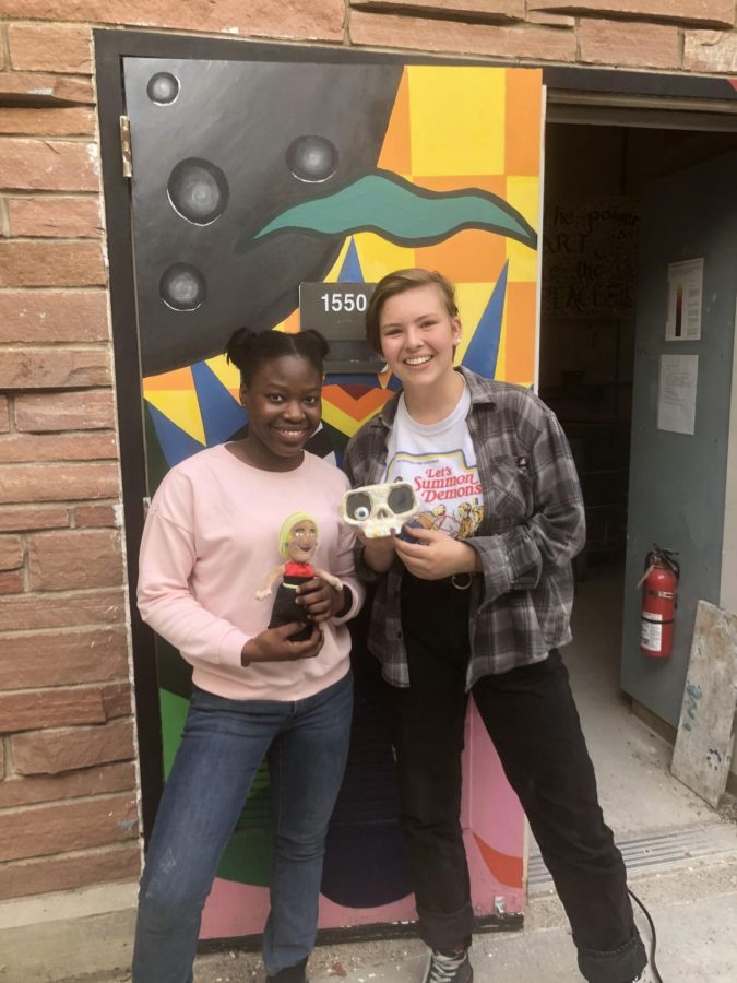 Friends Audrey Banintchie, junior (left), and Zizie Moffett, senior (right), show off their thrifted creations. Moffett was the overall winner of the challenge. Photo courtesy of Eleanore Hoffmeyer.