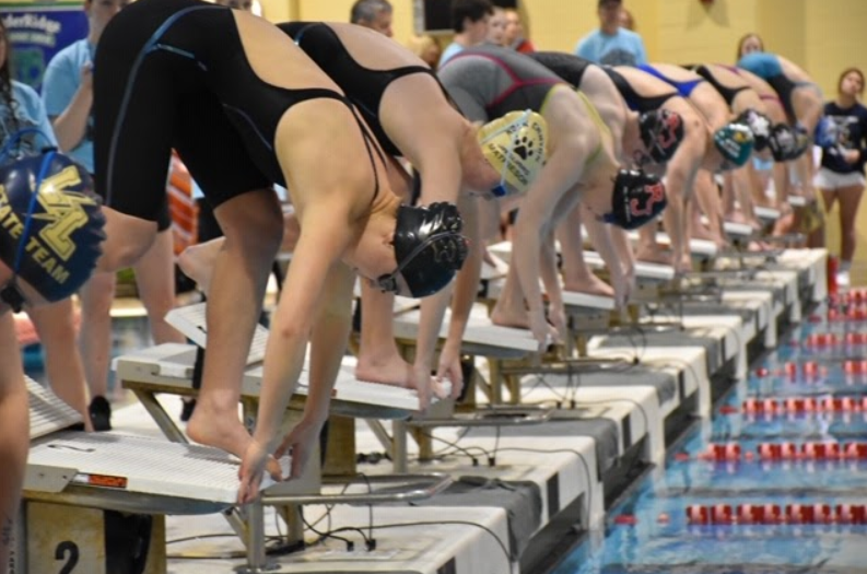 Culberson gets ready to race on the blocks. Photo courtesy of Emilia Culberson. 