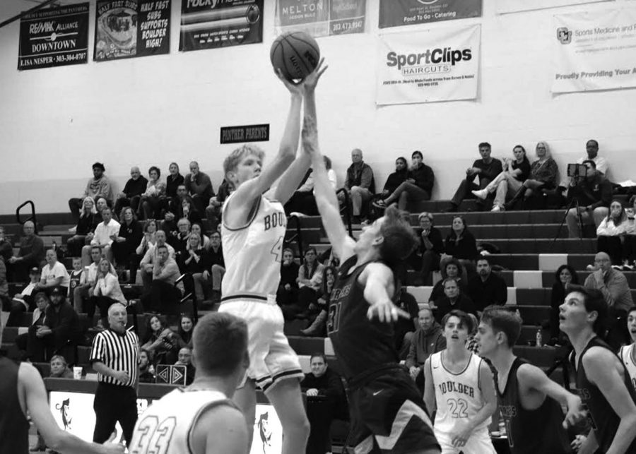 Senior+Pete+Boyle+rises+above+the+opposition+defense+in+a+convincing+76-68+win+over+Chatfield+High+School+on+Dec.+2.+Photo+courtesy+of+Elijah+Boykoff.