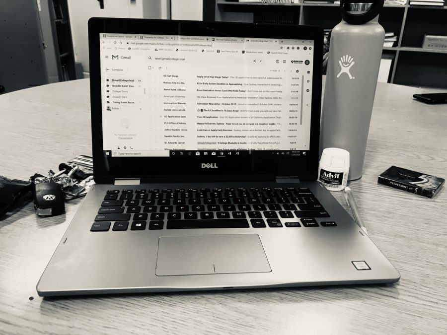 A simple set up that all high school students need to succeed: Computer, Water Bottle, and Advil. 