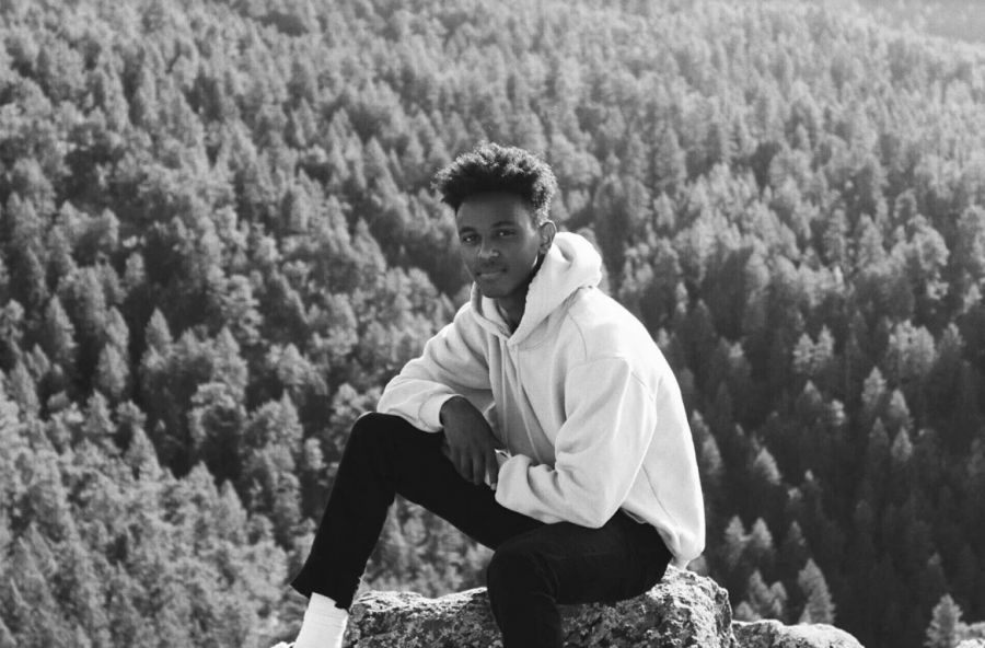 Senior Metkel Tewelde poses for a photo in the Colorado Mountains. 