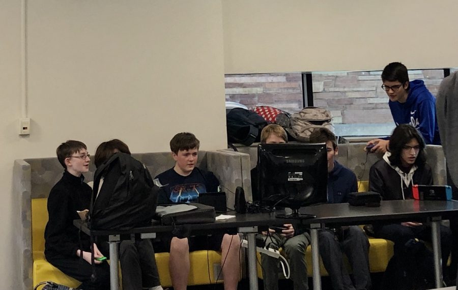The gamer group sits immersed in Super Smash Bros during Common Lunch.