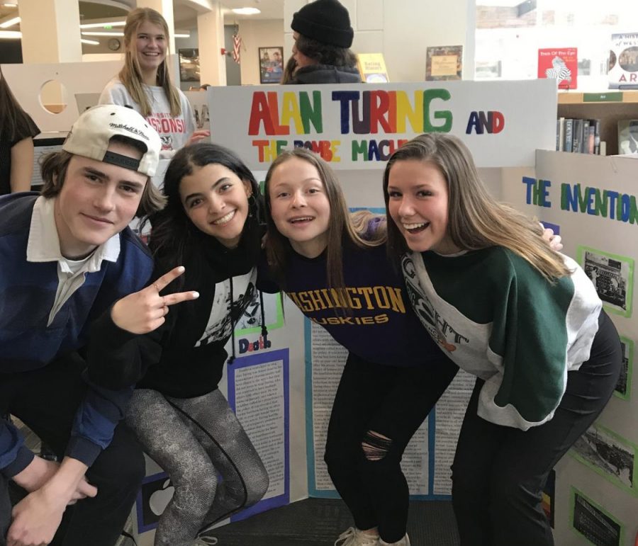 Sophomores Andres Persson Maya Ketterhagen, Natalie Hill and Erika Johnson infront of their National History Day exhibit