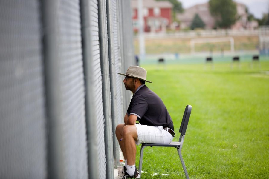 Head Coach Nick Salazar intently watches a match. He guided the Boulder High varsity tennis team to a 7-2 record this season and a chance for players to compete in Friday’s state match.