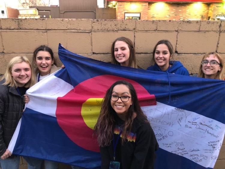 Myself and the friends that I made at a concert in 2018, including Ella Myers (middle, behind flag) and Iman Moaddeli (far right).