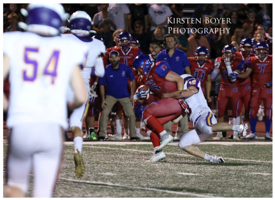 Dakota Hess 23, tackling Bejamin Mischke 24, as Boulder High defense hopes to continue their domination.