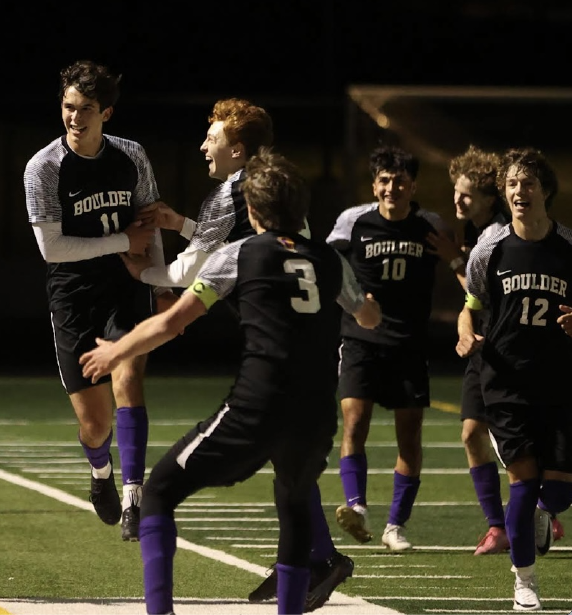 Boys Soccer celebrating one of their 4 goals joyfully in their October 25th playoff game vs Grandview.