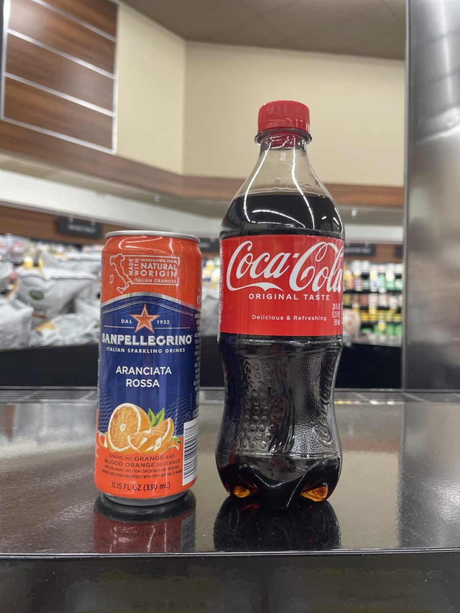 A side by side comparison between a 11 ounce Italian soda and a 20 ounce American Coke shows the monstrous growth of our beverages.