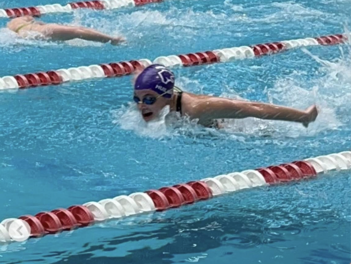 Hazel Huliman mid race at the statewide meet last year as a freshman. In this meet Hazel finished in the top 50 across the 5A class in the 100 breast.
