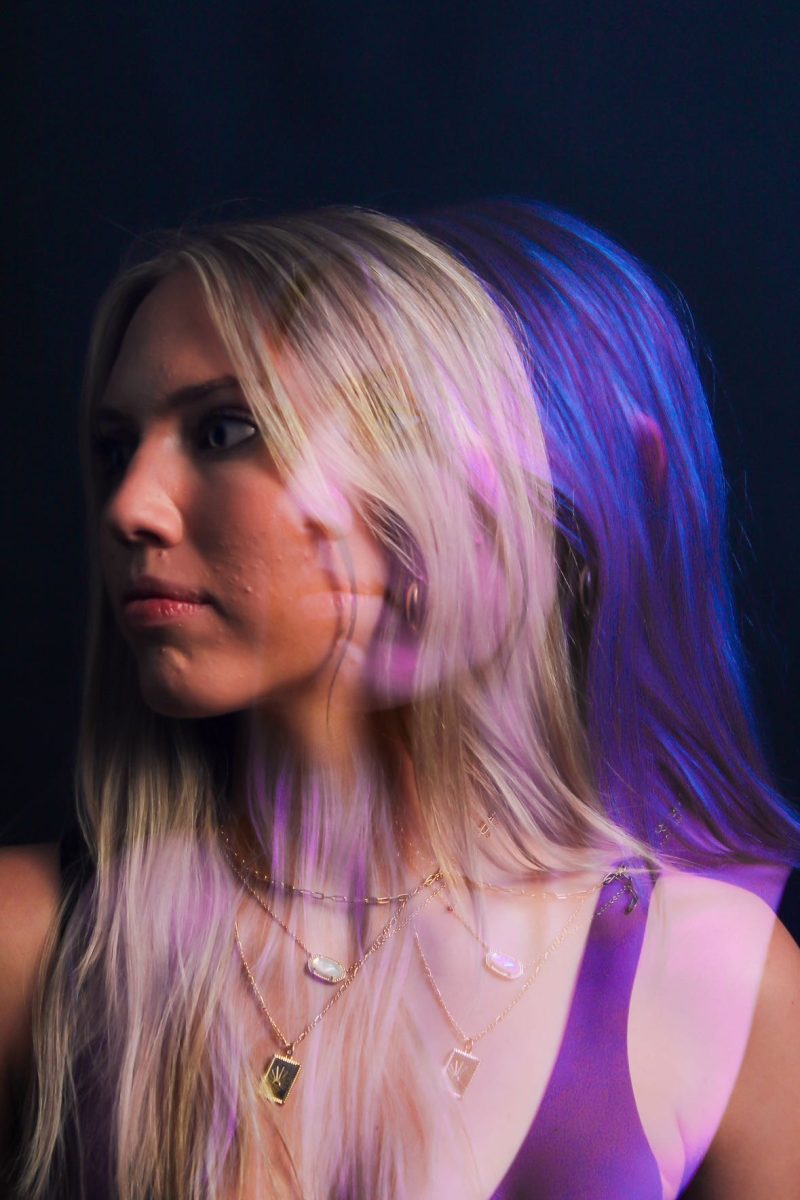 "This beautiful picture took more people and hours than one might expect," says Madi. "This is because the shadow was not done post shoot in editing but actually done by moving lights and opening and closing the camera to make it look like she has a colorful shadow."