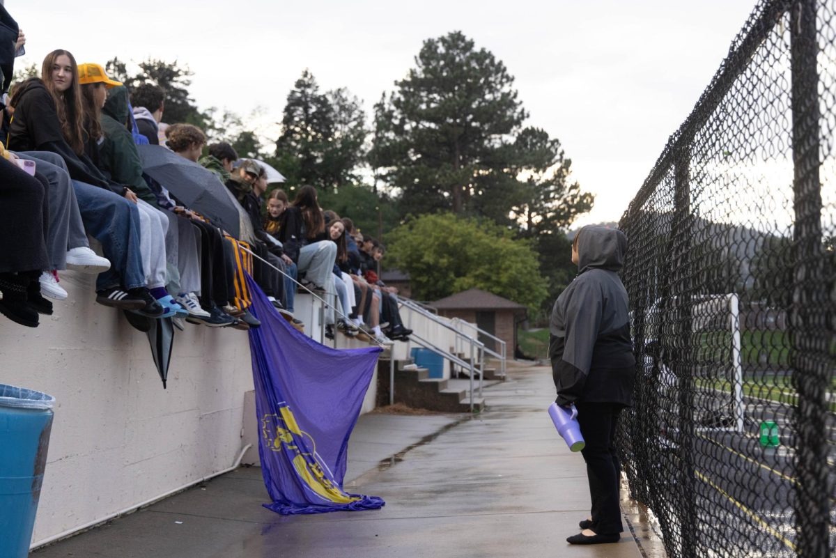Despite the new school policy against sitting on the wall, twelfth graders cling to a senior year tradition.