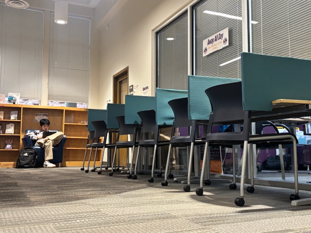 A row of chairs sit untouched in the Library during a lunch period.