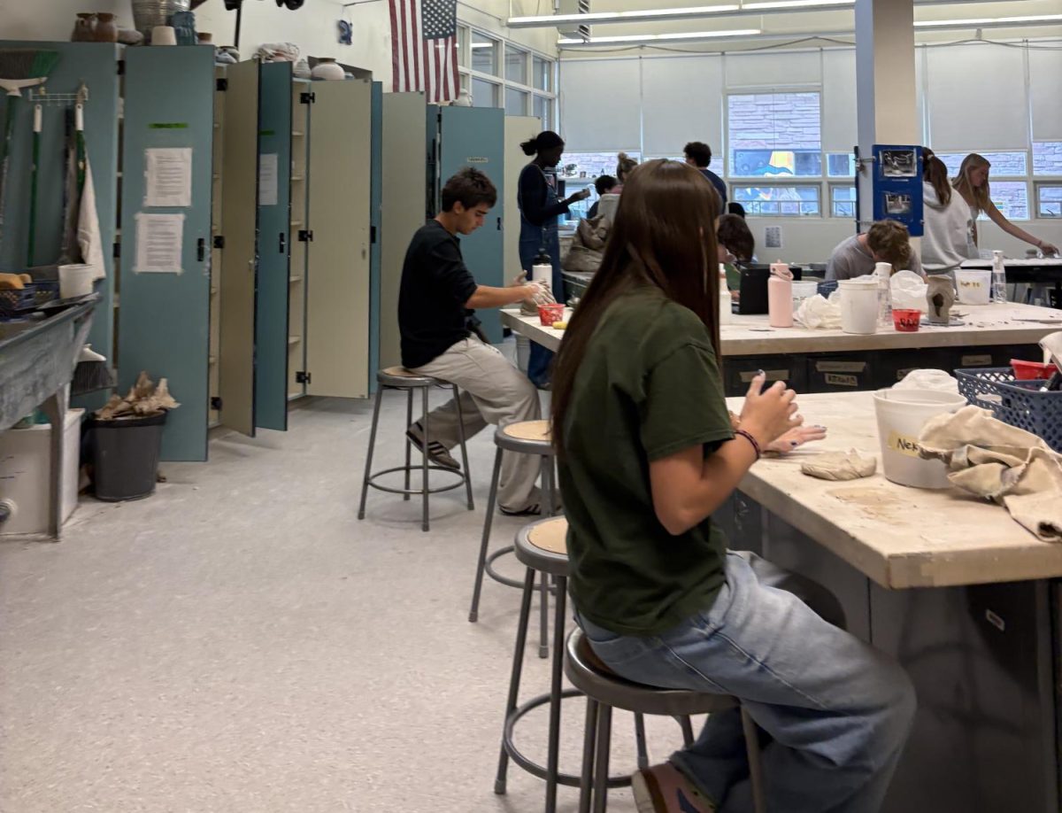 Students throw, sculpt, and carve clay masterpieces in the pottery room every day, now under the guidance of Ms. Wilson.
