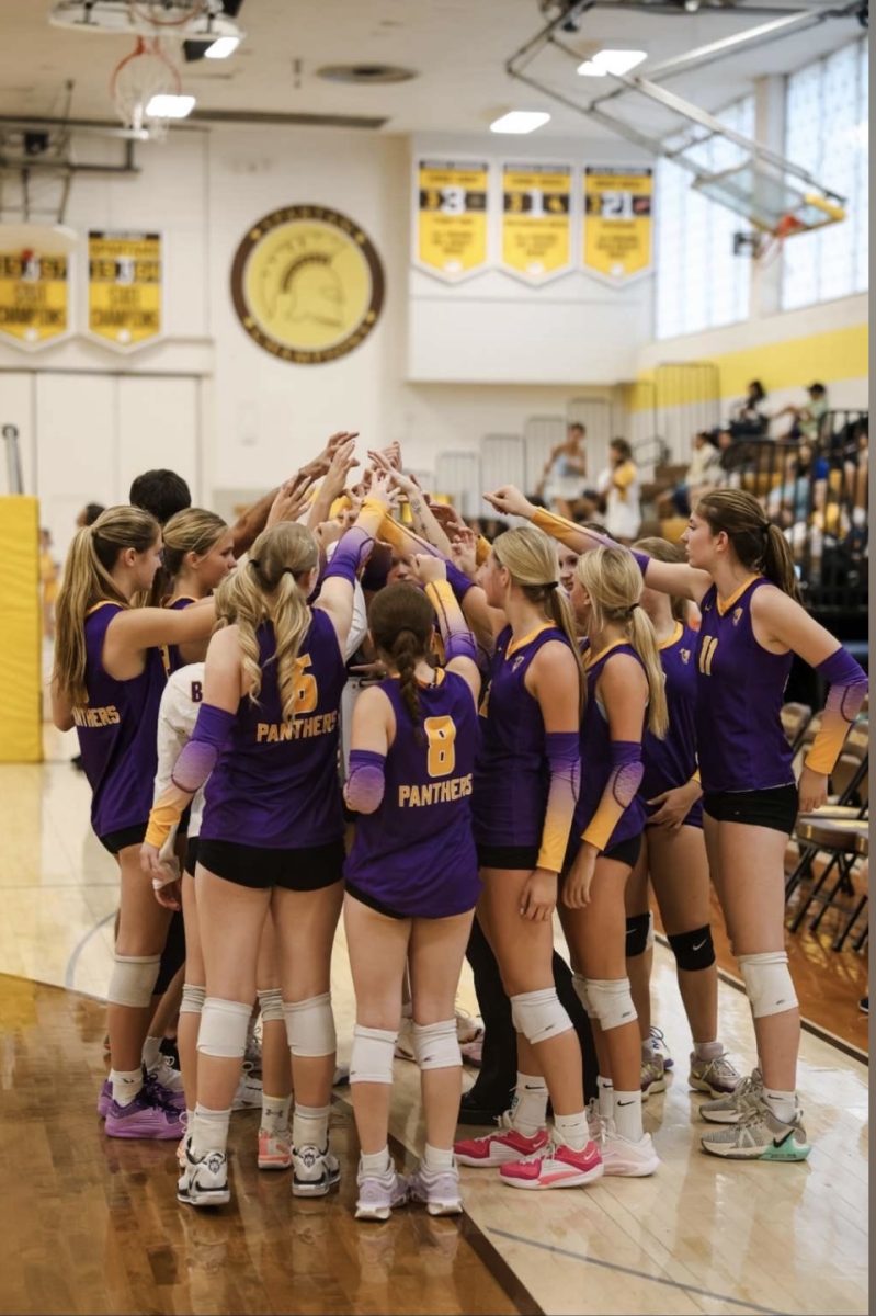 The Boulder HIgh Girls volleyball team huddle up in preparation for a game vs Thomas Jefferson High.